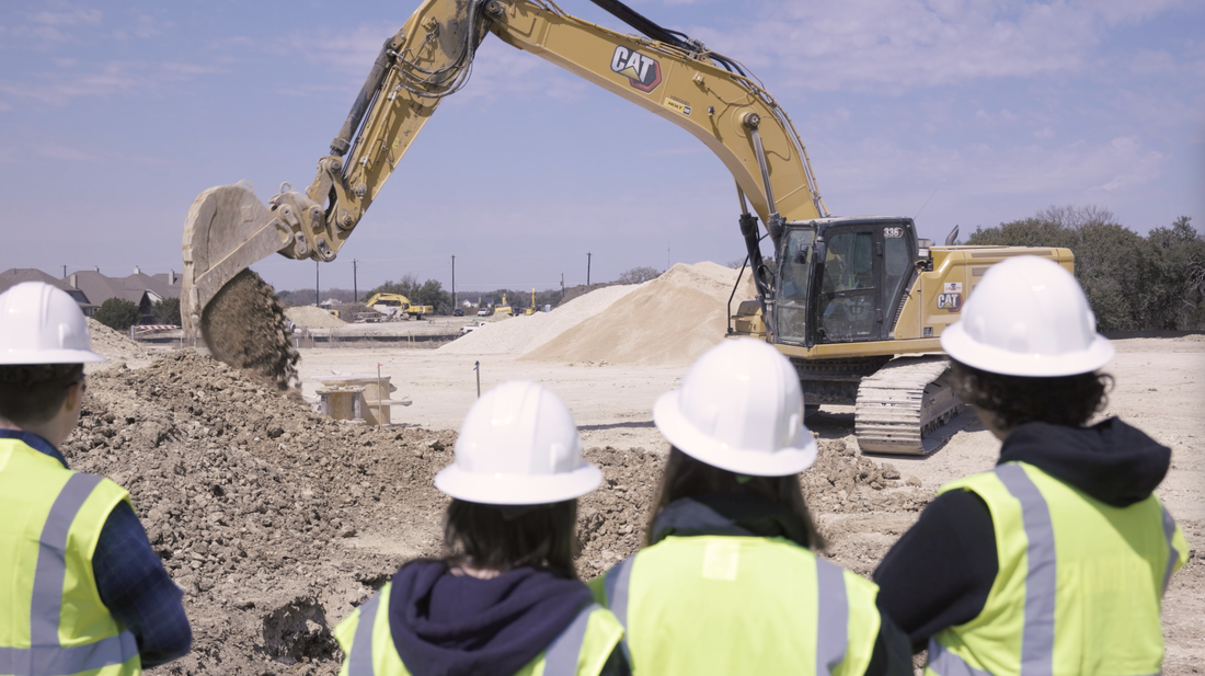 Students learn how to build subdivision ACEA COOL Experience construction hard hats excavator